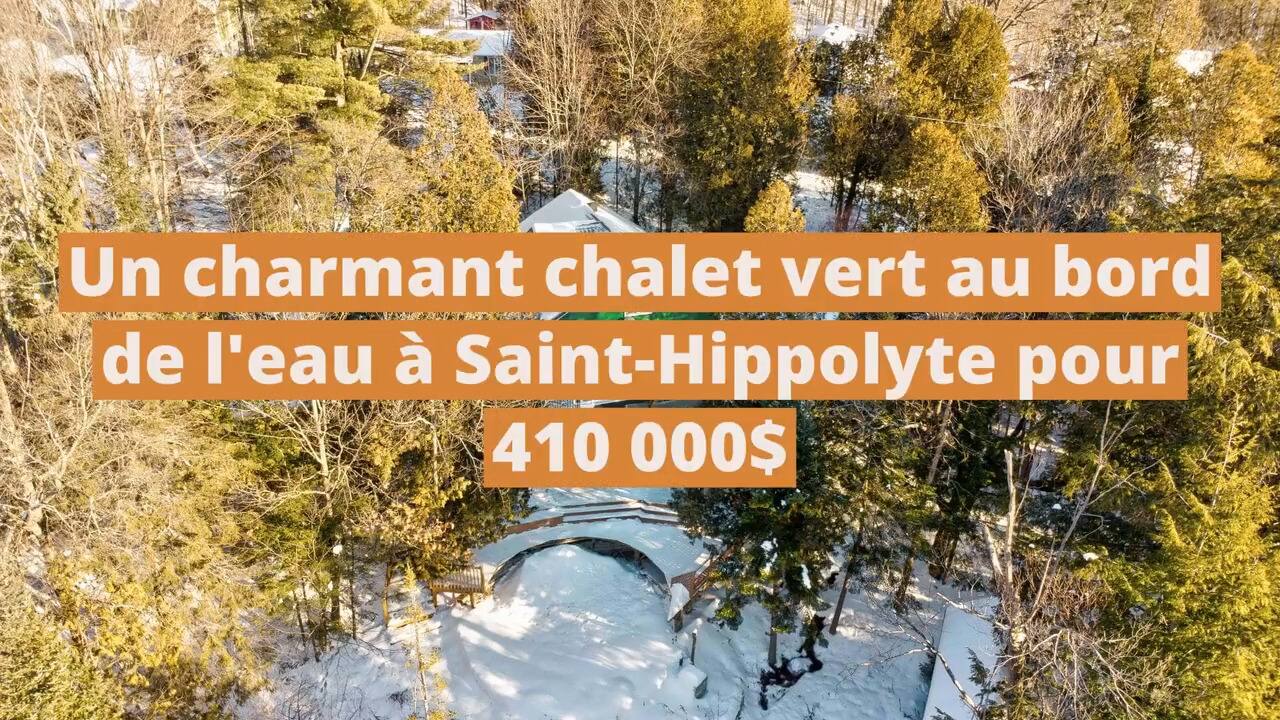 Un charmant chalet vert au bord de l'eau à vendre à Saint-Hippolyte pour 410 000$